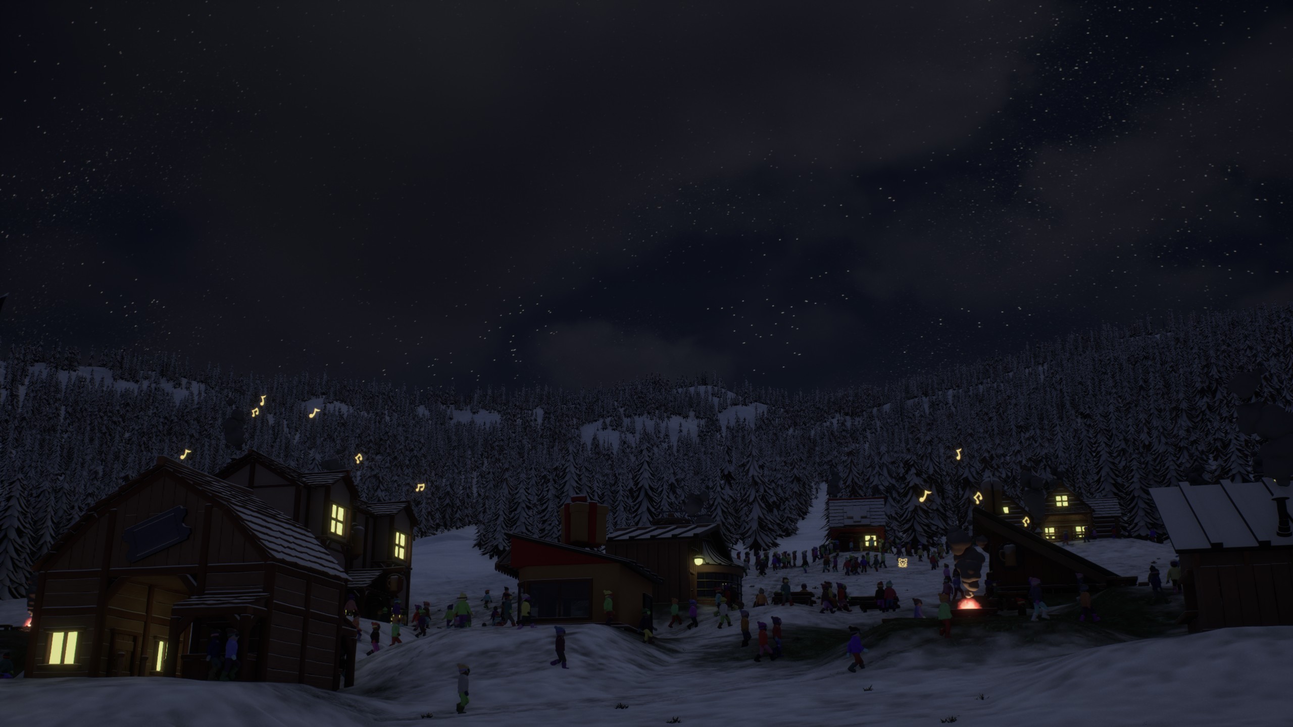 The resort village under falling snow at night